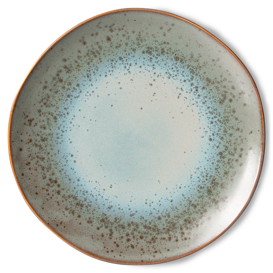 Ceramic plate with speckled design on a white background