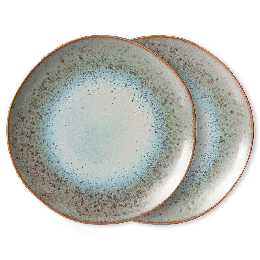 Two ceramic plates with a speckled design on a white background