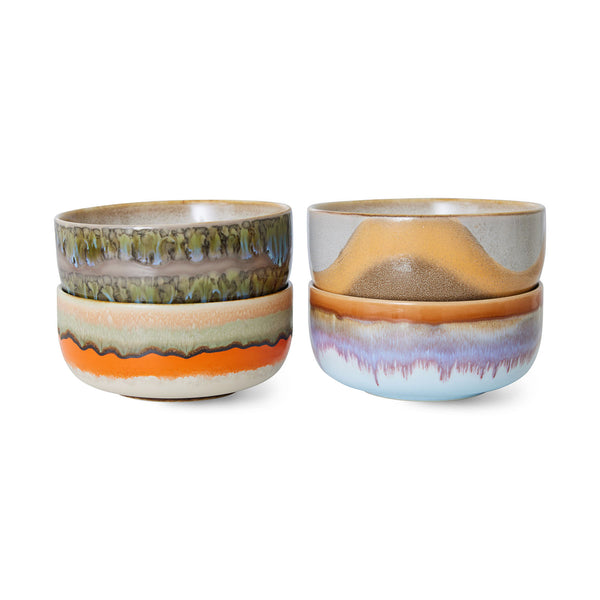 Two sets of ceramic bowls with multicolored glaze on a white background