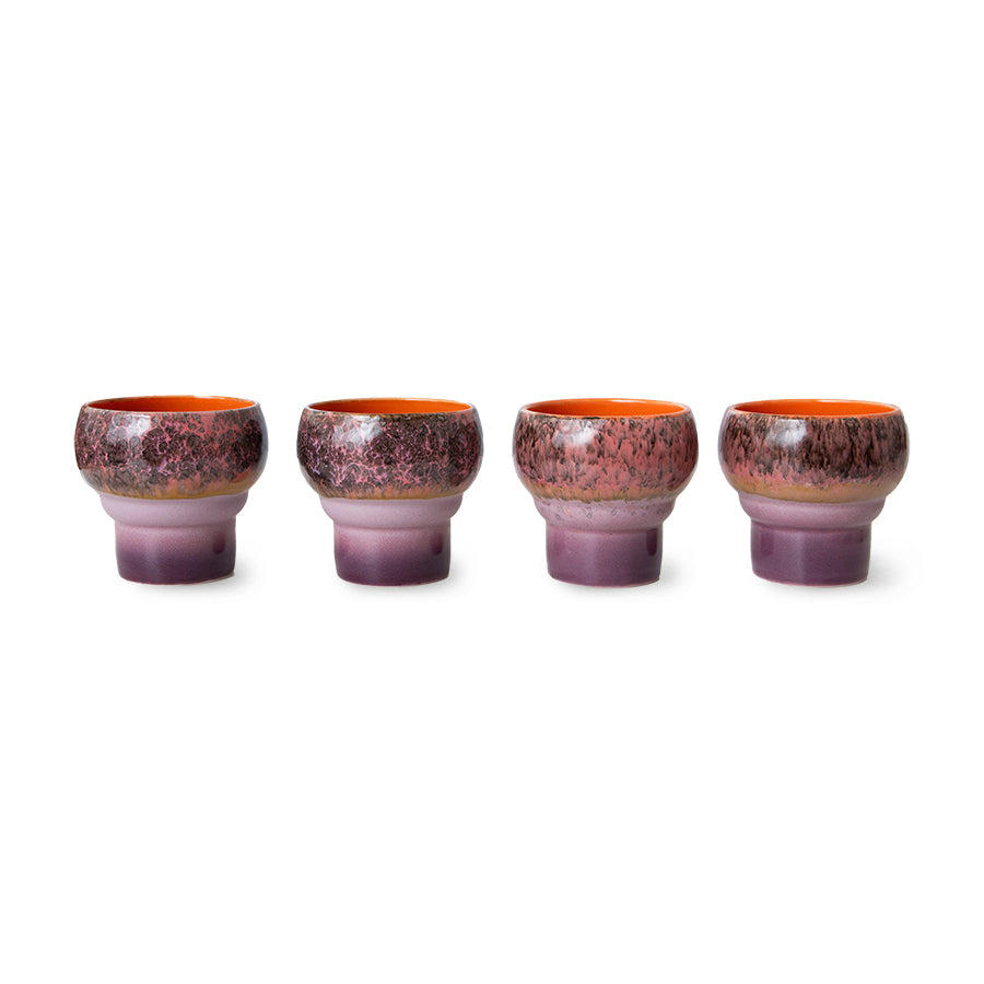 Set of four ceramic cups with a gradient purple and orange design on a white background