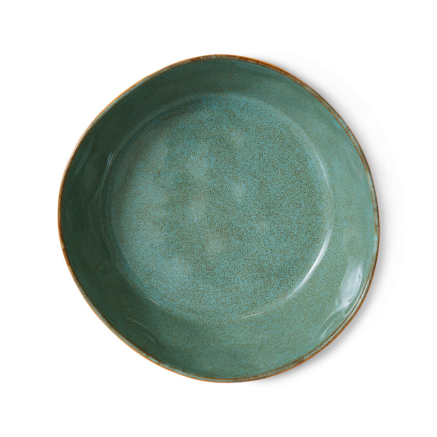 Green ceramic plate on a white background
