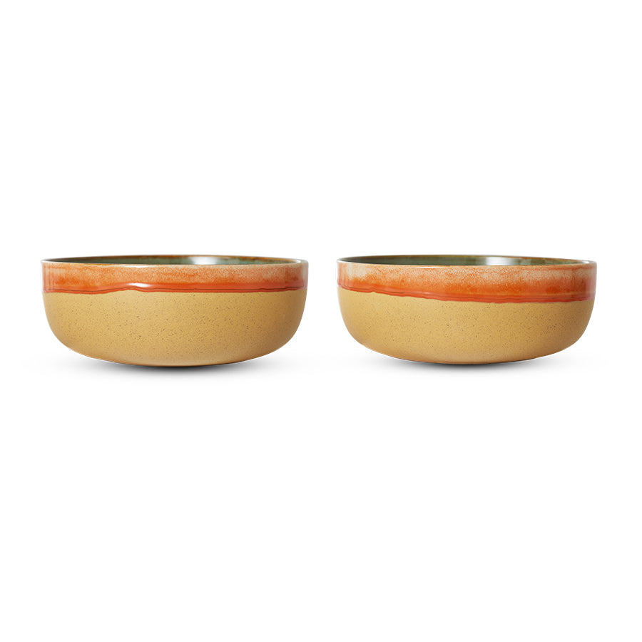 Two ceramic bowls with a beige body and orange rim on a white background