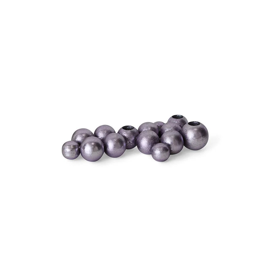 shiny purple iron candle holder made from round bubbles on a white background