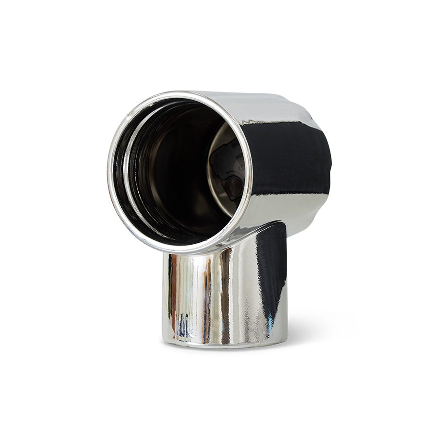 Metallic object with black interior on a white background