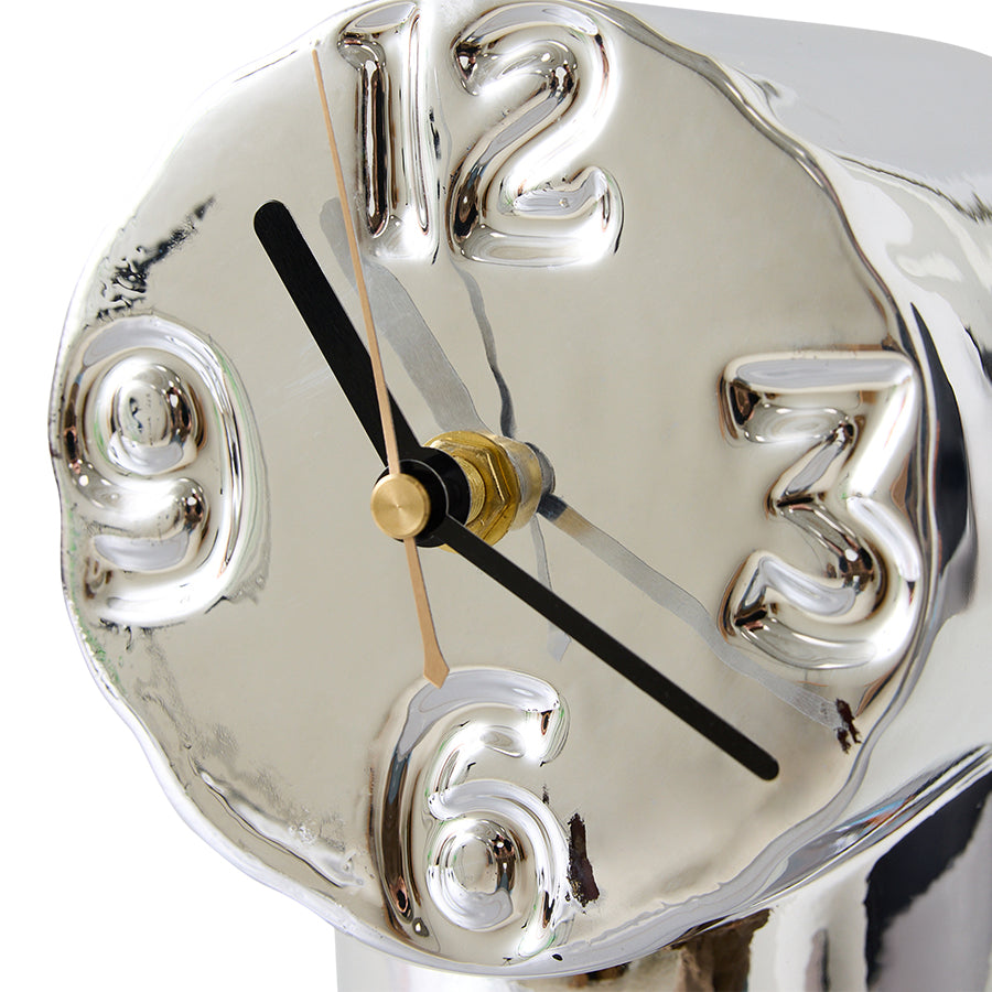 Silver clock with black and gold hands on a white background
