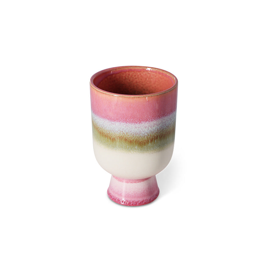 Multicolored ceramic cup on a white background