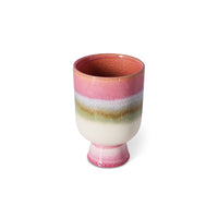 Multicolored ceramic cup on a white background