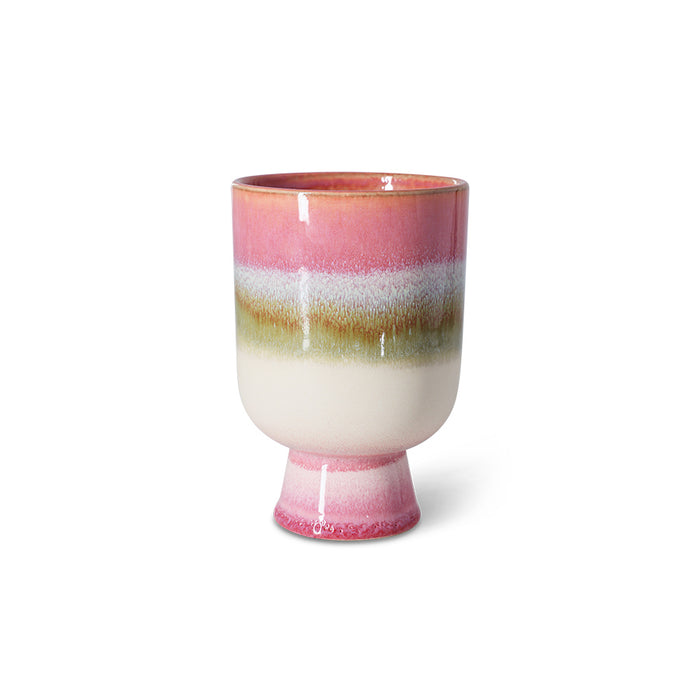 Ceramic cup with multicolored stripes on a white background