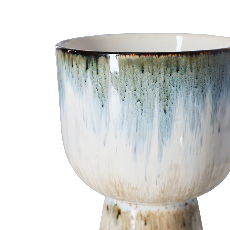 ceramic flower pot in blue and brown tones on a white background