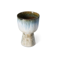 ceramic flower pot in blue and brown tones on a white background