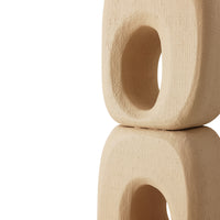 Beige ceramic block with a central hole on a white background