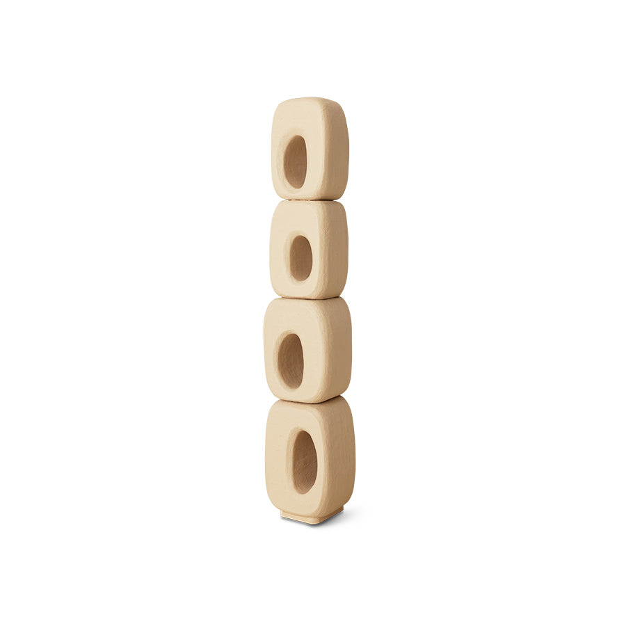 Stack of four beige wooden beads on a white background