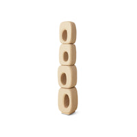 Stack of four beige wooden beads on a white background