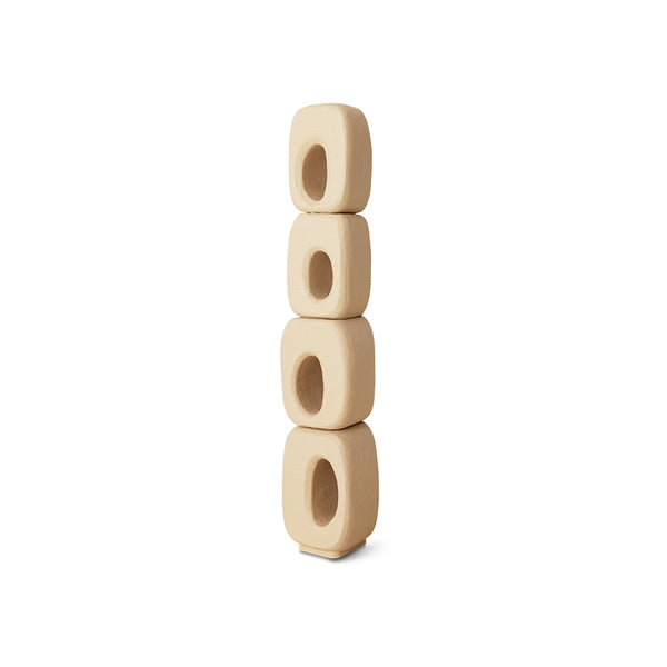 Stack of four beige wooden beads on a white background