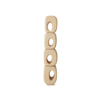 Beige ceramic wall hanging with circular holes on a white background