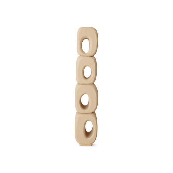 Beige ceramic wall hanging with circular holes on a white background