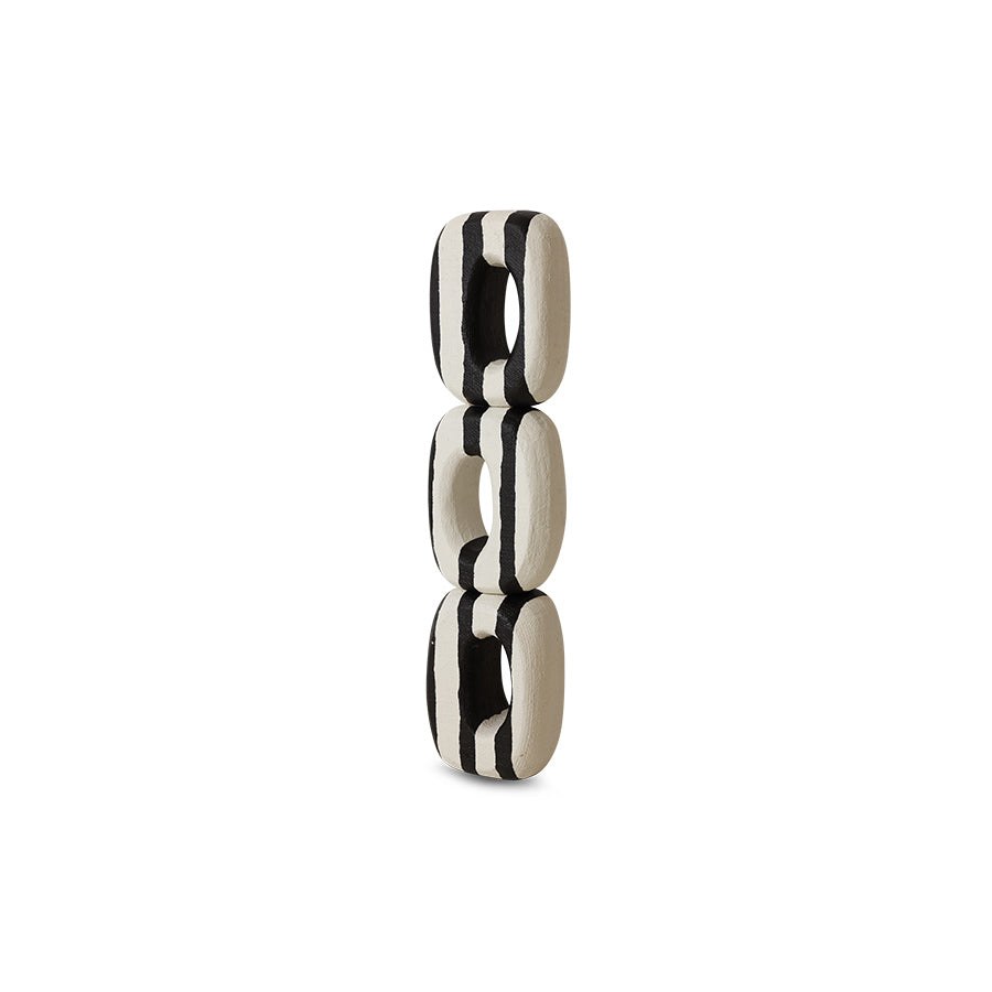Black and white ceramic number '8' on a white background