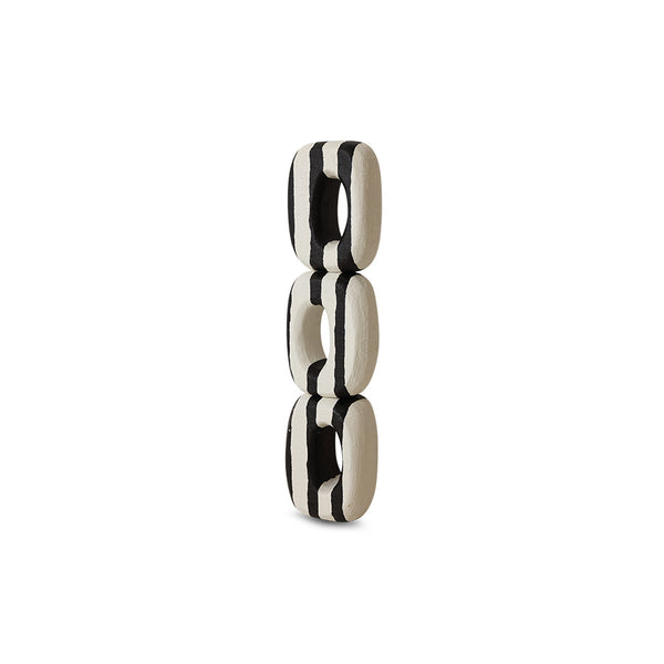 Black and white ceramic number '8' on a white background
