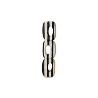 Black and white striped cylindrical object on a white background