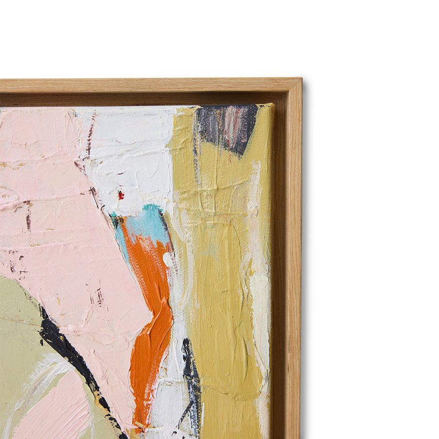Abstract art painting with a wooden frame on a white wall