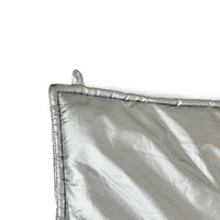 Silver reflective blanket on a white background