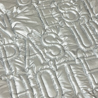 Silver quilted fabric with quilted pattern
