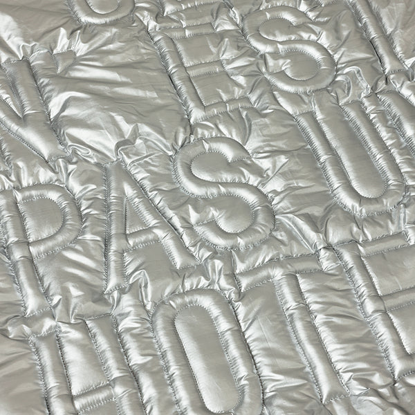 Silver quilted fabric with quilted pattern