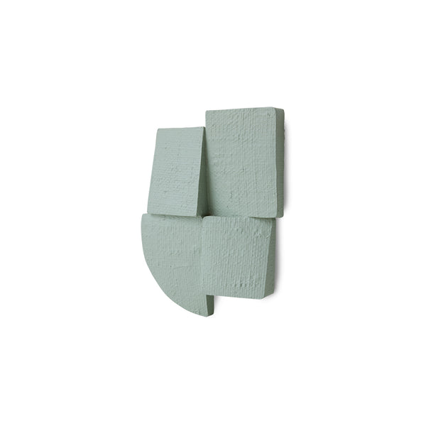 green textured wall sculpture on a white background