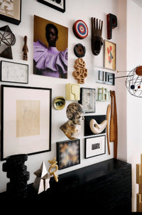 Wall with various art pieces and decorative items