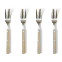 Four forks with beige handles on a white background