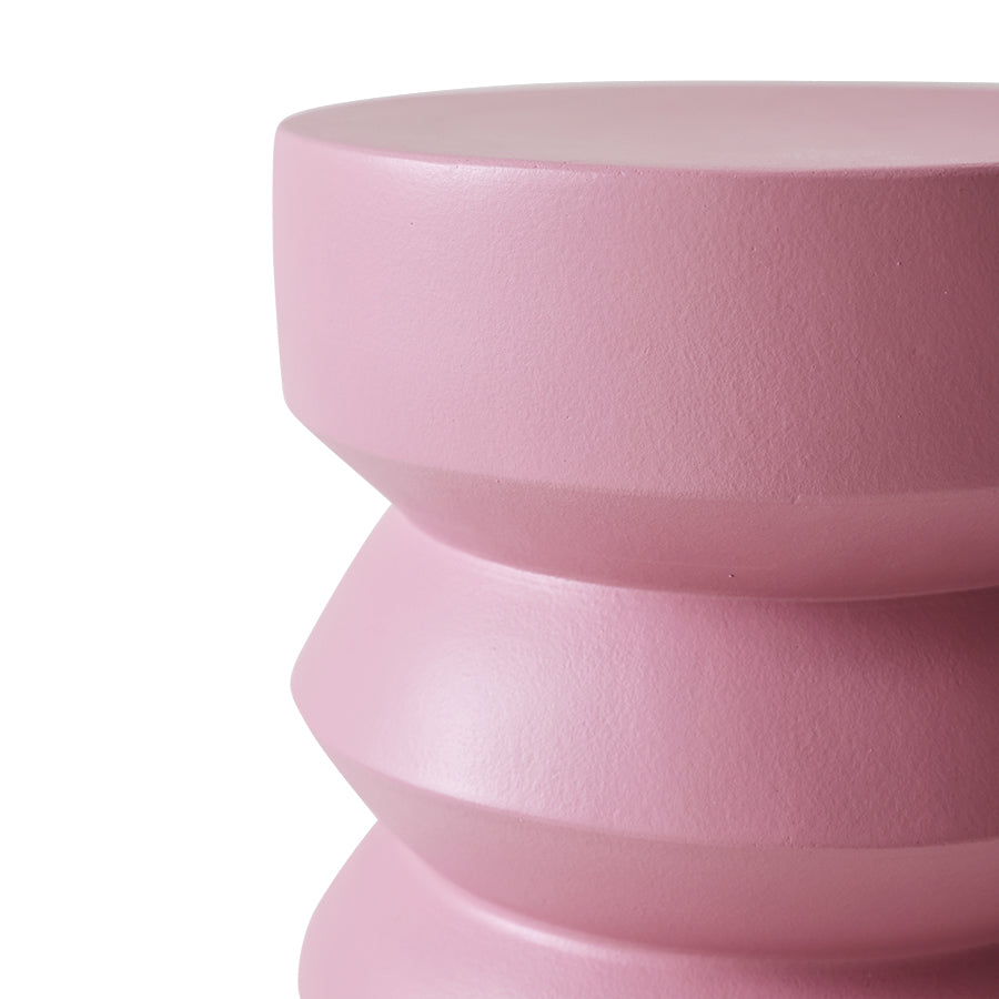 Pink cylindrical object on a white background