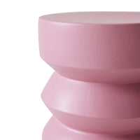 Pink cylindrical object on a white background