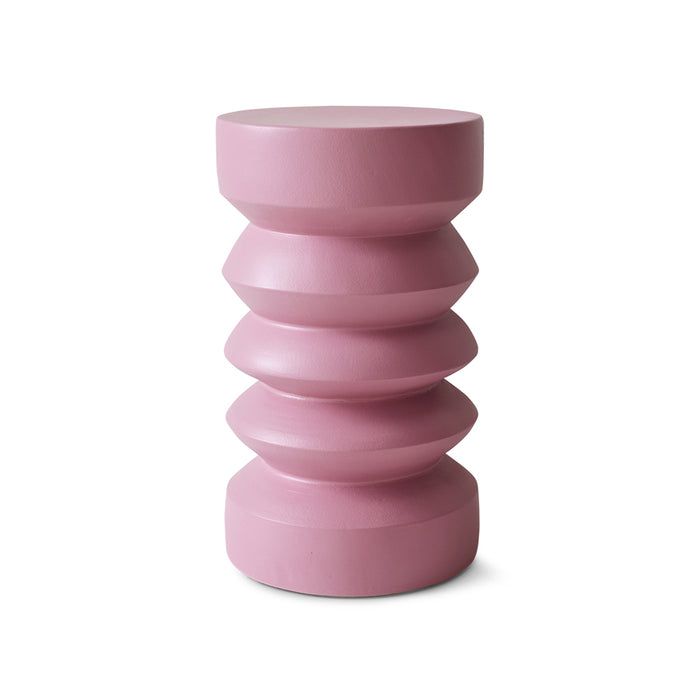 Pink cylindrical vase with stacked design on a white background