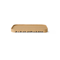 Rectangular wooden tray with wavy edge on a white background