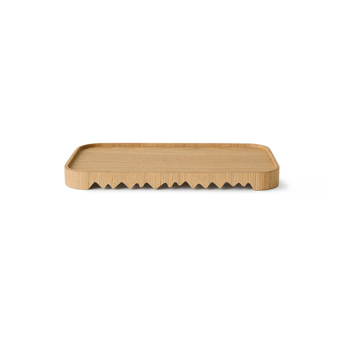 Rectangular wooden tray with wavy edge on a white background