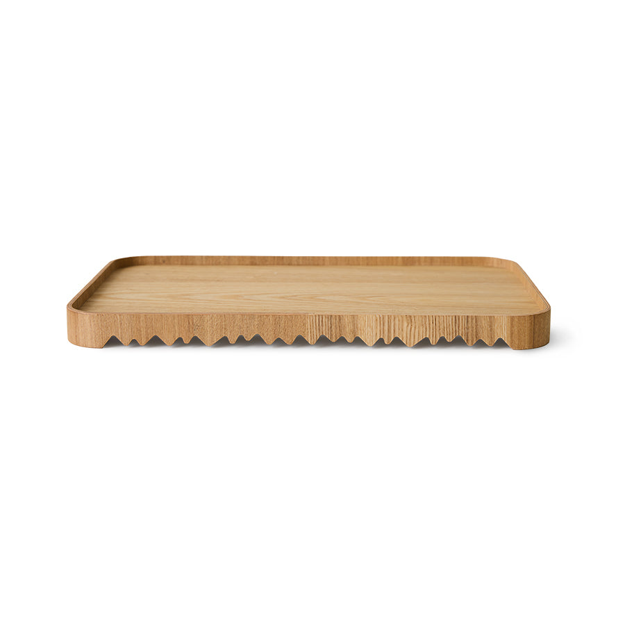 Wooden serving tray board with wavy edge on a white background