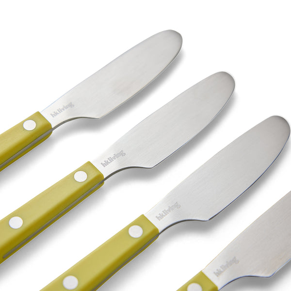 Set of knives with yellow handles on a white background