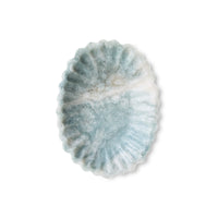 pale blue and white sculped tray on a white background
