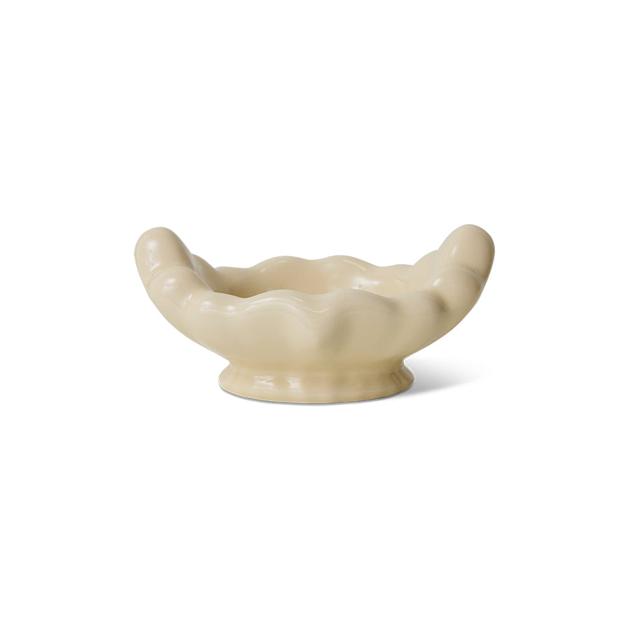 White bowl with sculptural edges on a white background