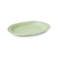 Green ceramic plate on a white background