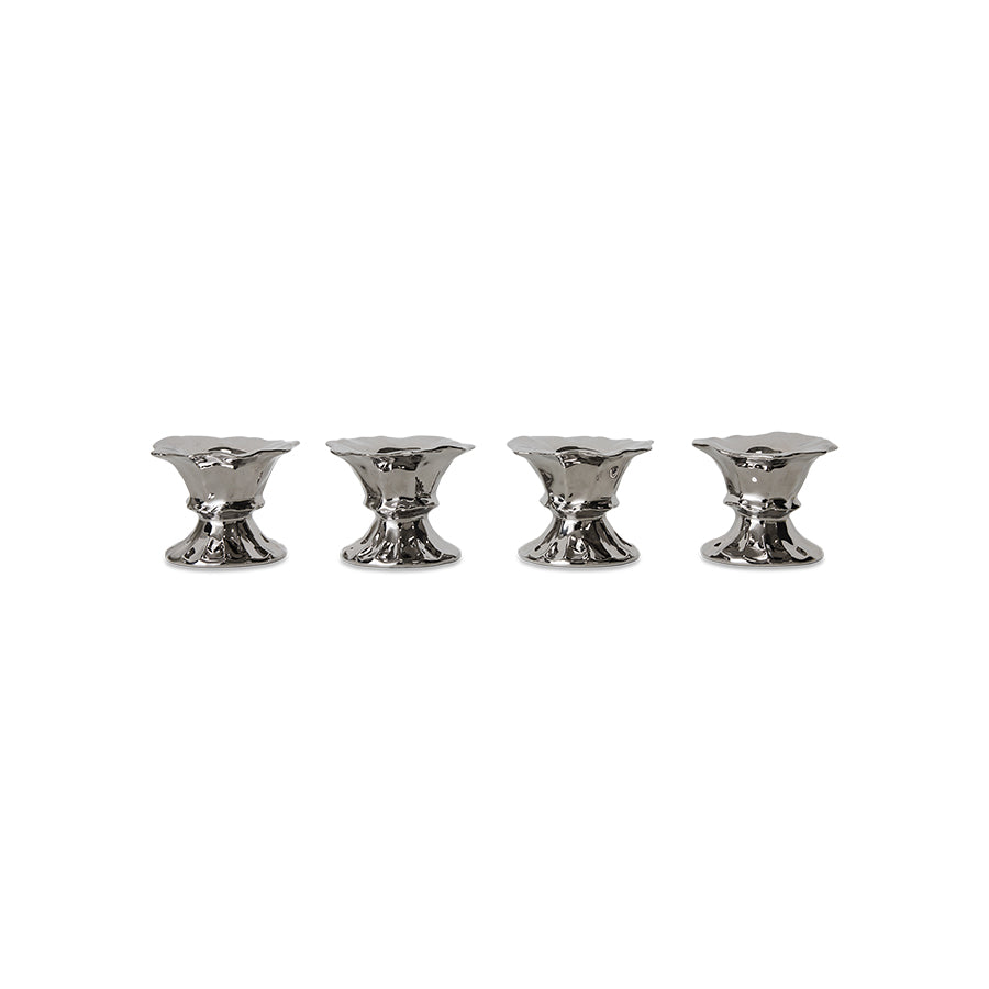 4 silver egg cups on white background