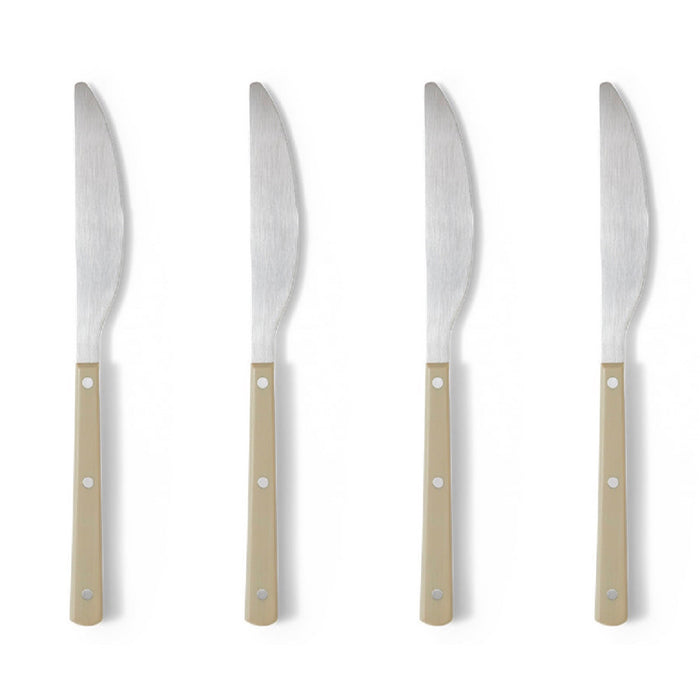Four knives with beige handles on a white background