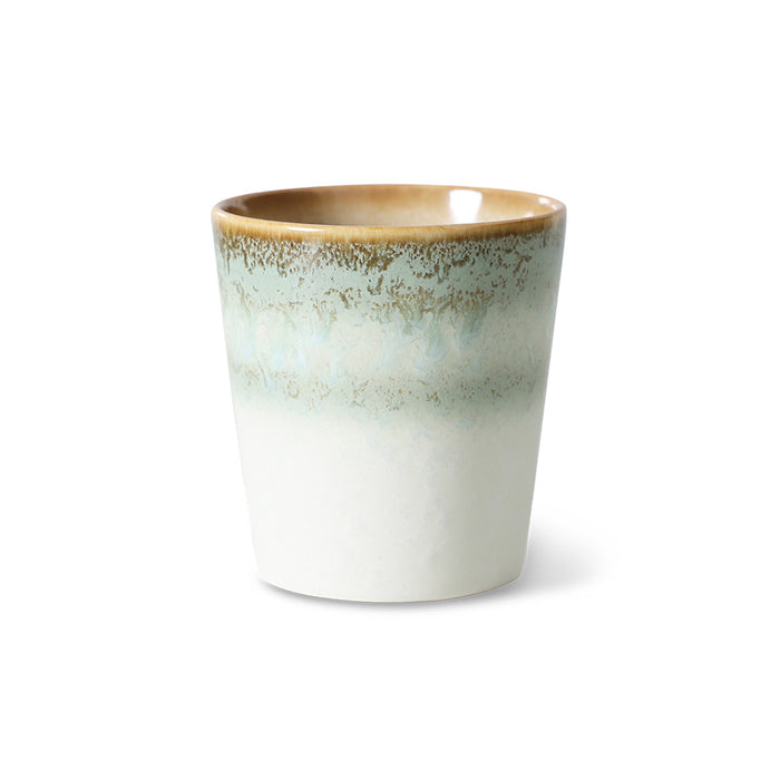pastel colored ceramic tumbler cup on white background
