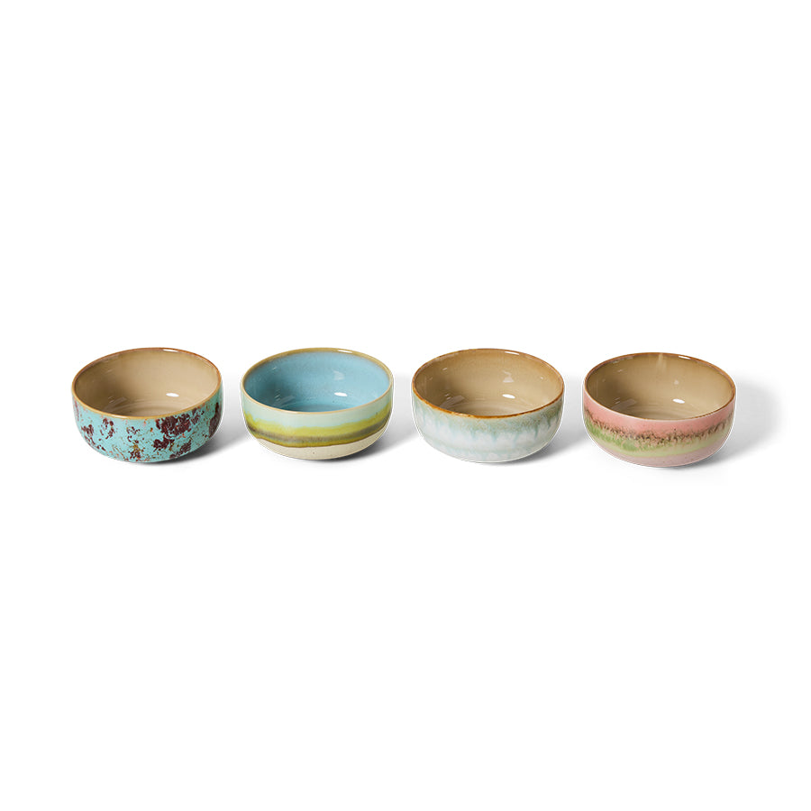 Four ceramic bowls with different patterns on a white background