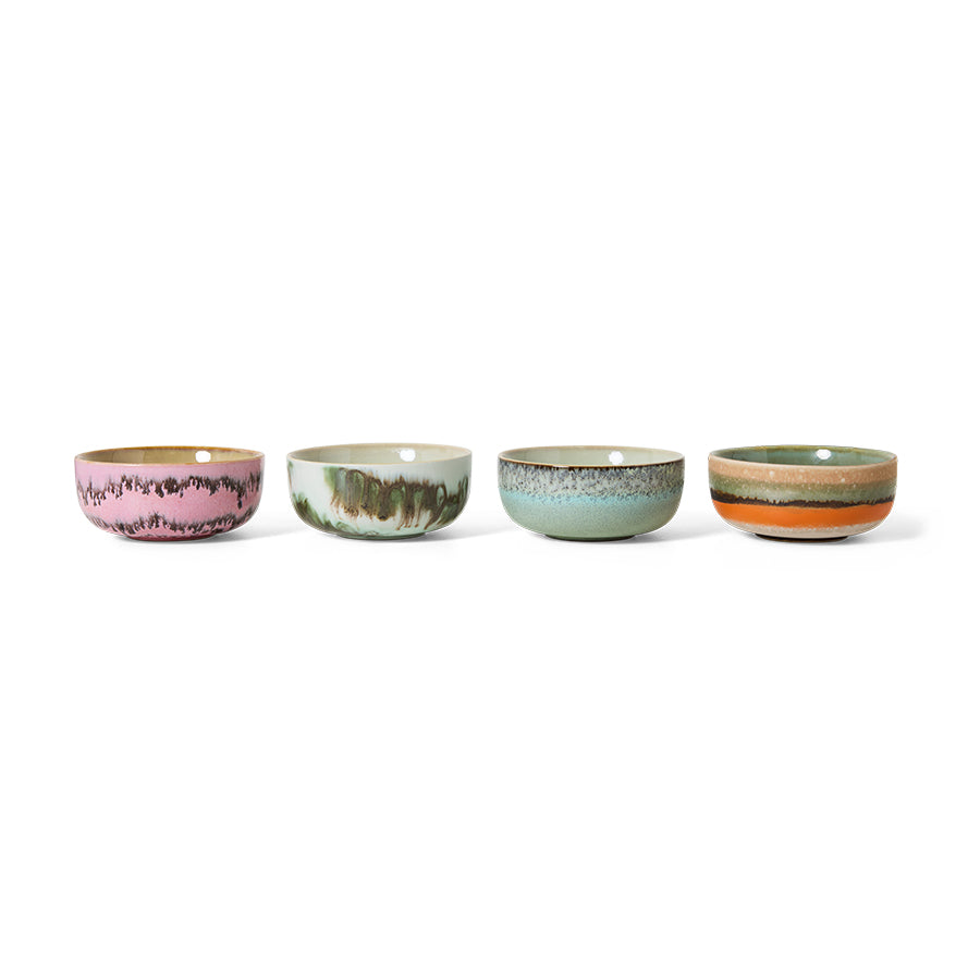 Four ceramic bowls with multicolor glaze on a white background