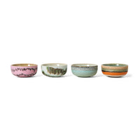 Four ceramic bowls with multicolor glaze on a white background