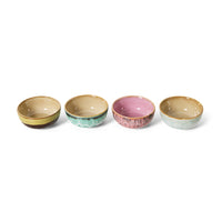 Set of four ceramic bowls with different colors on a white background