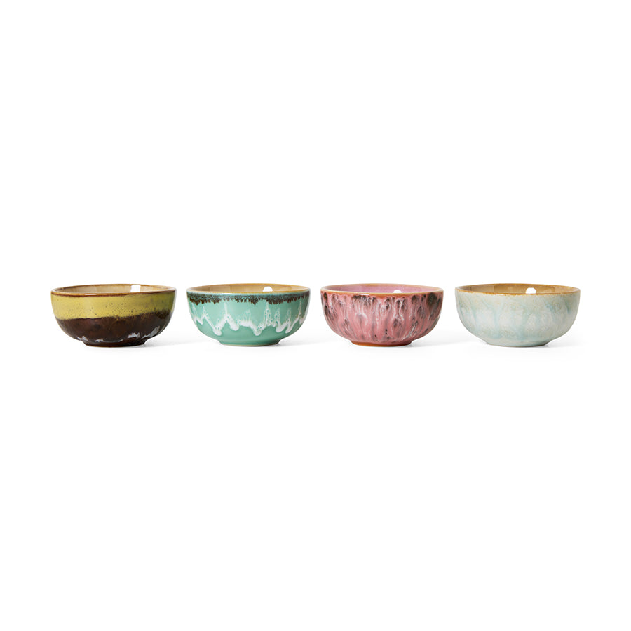 Set of four colorful ceramic bowls on a white background