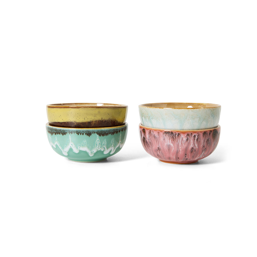Two sets of ceramic bowls with textured surfaces on a white background
