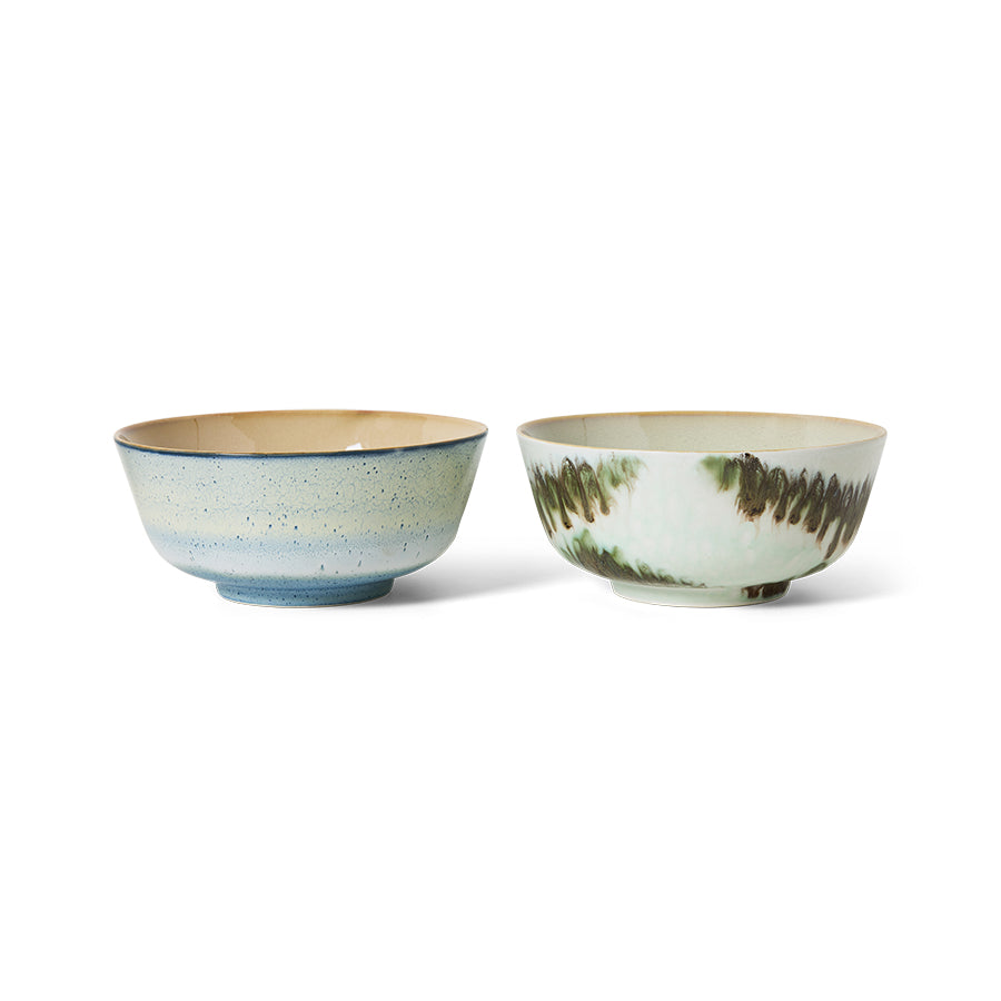 Two ceramic bowls with textured surfaces on a white background